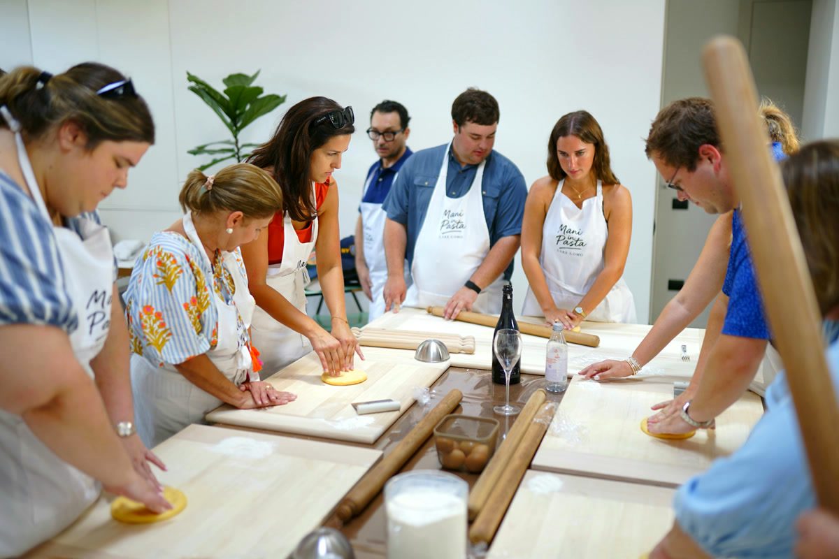 Guests rolling the sfoglia with wooden matterelli