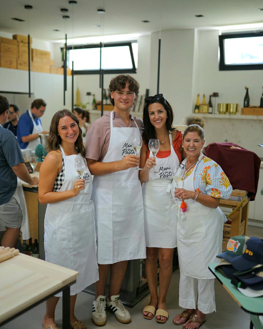 Friends posing with their aprons and spritz